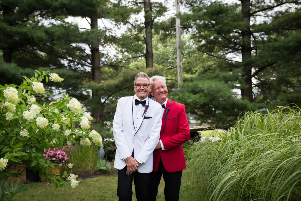 Same sex couple on their wedding day in the garden