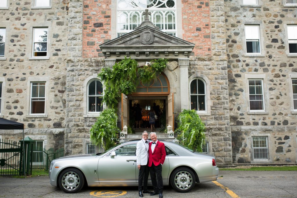 Same sex couple at abbaye, OKA with a rolls royce