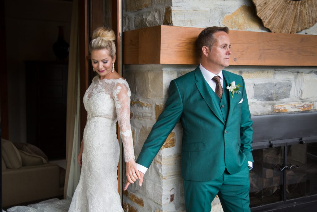 Wedding photography Montreal, bride and groom holding hands before they see eachother for the first time