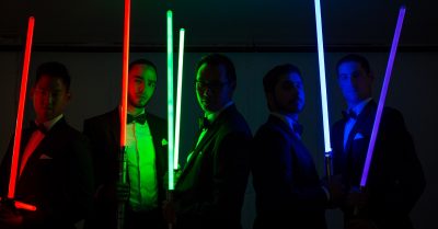 groom and groomsmen portrait with laser lighting